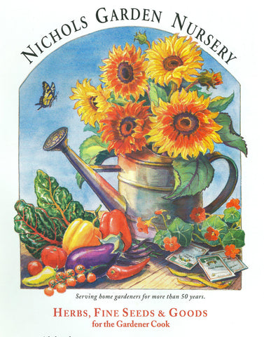 Sunflowers in watering can with vegetables scattered below